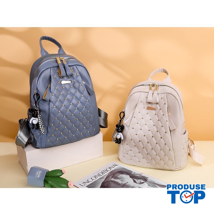 Rucsac dama bleufashion cu imprimeu in romburi buzunar exterior cu fermoar din piele eco si breloc ursulet ACRD270